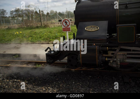 Steam train on the Bure Valley 15 inch (381mm) minimum gauge heritage railway in Alysham, Norfolk, England Stock Photo