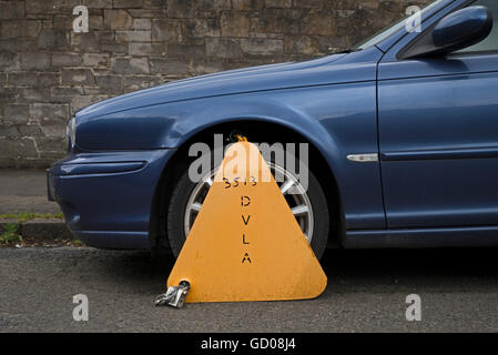 Untaxed car clamped by the DVLA. Stock Photo