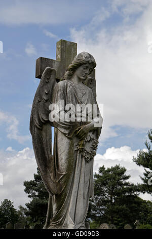 cemetery angel statue sculpture on a grave Stock Photo