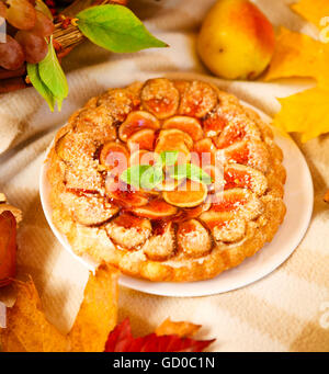 Homemade fig pie with nuts and honey on the picnic Stock Photo