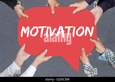 Group of people holding with hands the word motivation strategy coaching training success successful Stock Photo