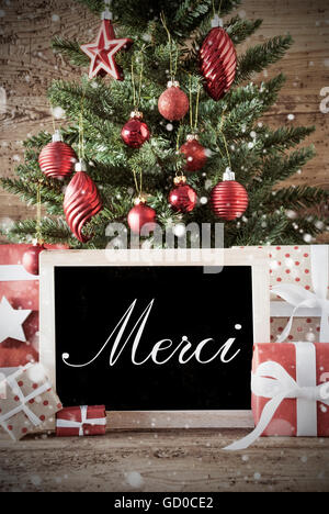 Nostalgic Christmas Tree With Merci Means Thank You Stock Photo