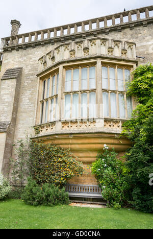 Oriel window with bench underneath, at Lacock Abbey, Lacock, Wiltshire, UK Stock Photo