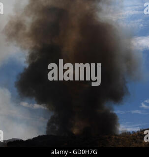 Thick smoke is seen for miles from the I 5 freeway from a 3rd alarm ...