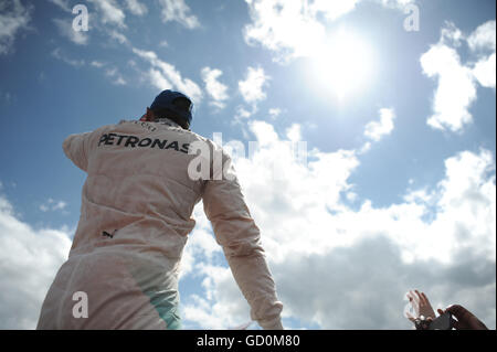 Silverstone, UK. 10th July, 2016. Lewis Hamilton does a crowd surf after winning the British grand prix. Credit:  Kevin Bennett/Alamy Live News Stock Photo