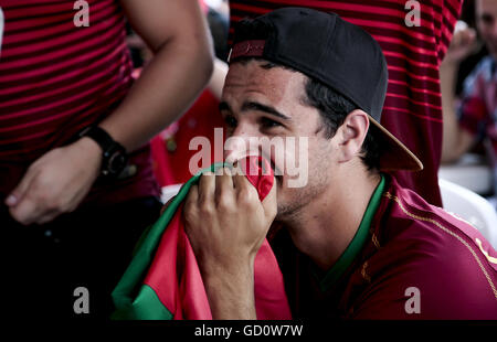 Toronto, Ontario, Canada. 10th July, 2016. Fans of the Portugal team, take the streets in downtown Toronto around College Street, partying after Portugal wins the Eurocup Finals. Portugal win the match against France 1-0 at the Stade de France in Paris, Toronto fans flooded the streets, singing, blowing whistles and waving Portuguese flags. © Joao Luiz De Franco/ZUMA Wire/Alamy Live News Stock Photo