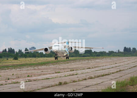 Kiev, Ukraine - August 3, 2011: Antonov An-148 regional passenger jet plane is taking off from the manufacturer's runway Stock Photo
