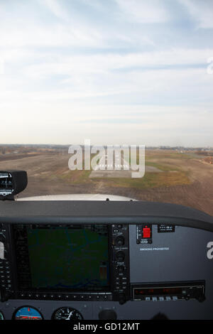 Kiev, Ukraine - November 12, 2010: Approaching the runway for landing from the cockpit of the Cessna 172 Skyhawk Stock Photo