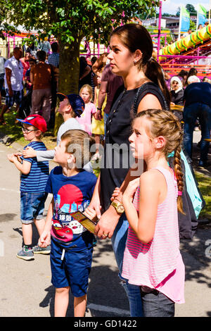 Ronneby, Sweden - July 9, 2016: Big public market day in town with lots of people. Here an attractive woman and some children wa Stock Photo