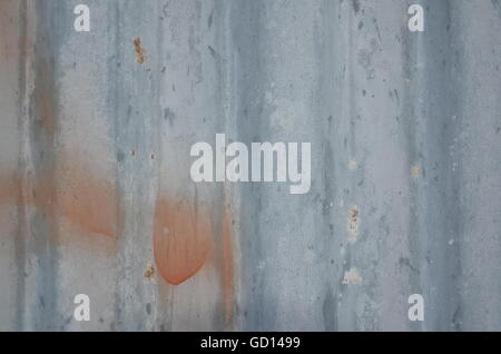 Blue container wall red spots old dirty white spots rippled Stock Photo