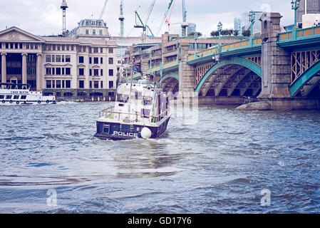 Metropolitan Police Boat on River Thames on high speed patrol in London Stock Photo
