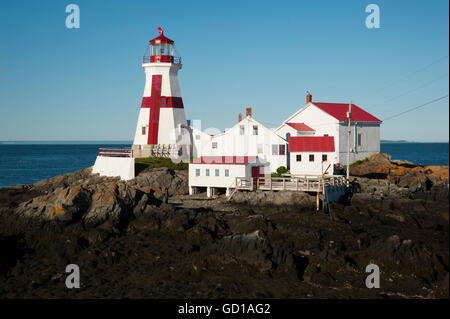 Head Harbor lighthouse is a Canadian beacon with its unique painted cross, located around the lowest tides on the East Coast. Stock Photo