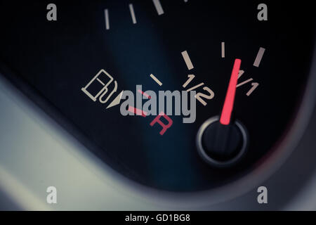 Close up shot of a car's dashboard with the fuel gauge. Stock Photo