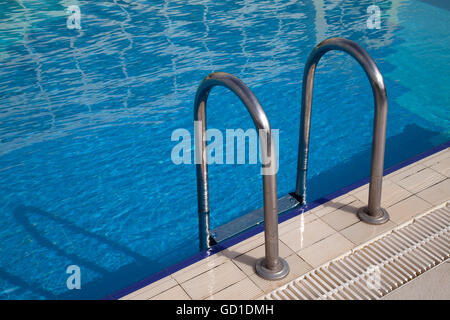 Swimming pool and ladder Stock Photo