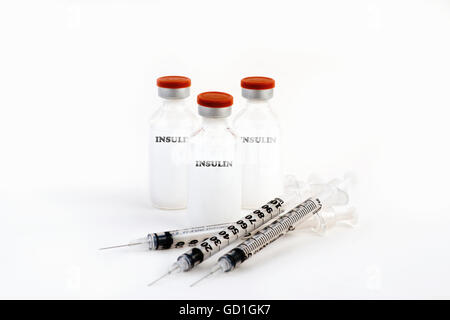 Insulin and syringe against a white background Stock Photo