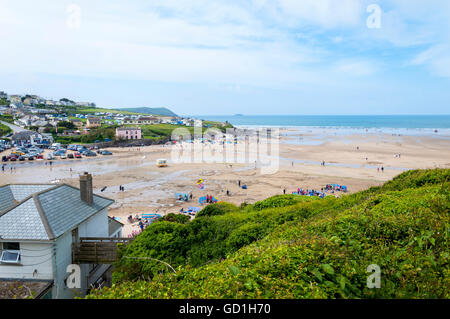 Holidaymakers on Polzeath beach, Cornwall, England, UK Stock Photo