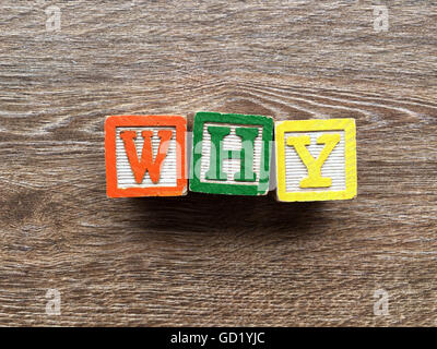 WHY written with wood block letter toys Stock Photo