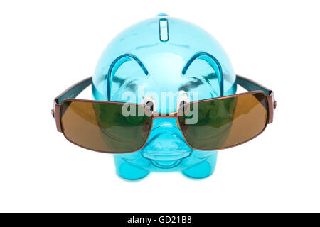Glass piggy bank with sunglasses isolated on white Stock Photo
