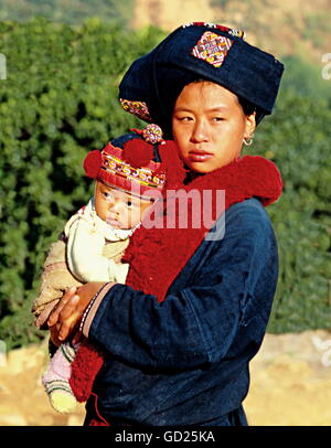 geography / travel, Thailand, Northern Thailand, mountain tribe of Yao, village near Chiangrai, woman with baby on arms, historic, historical, 20th century, mother, child, traditional, national, garb, clothes, infant, people, inhabitants, tribes, ethnic, ethnology, ethnicity, women, female, Additional-Rights-Clearences-Not Available Stock Photo