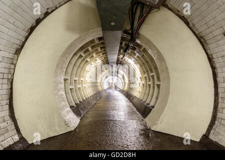 The Greenwich Foot Tunnel crosses beneath the River Thames, linking Greenwich in the south with the Isle of Dogs to the north. Stock Photo