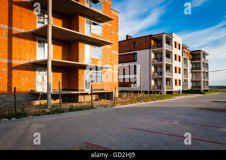 Building under construction and new block in the background. Stock Photo