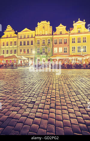 Vintage toned Old Market Square in Poznan at night, Poland. Stock Photo