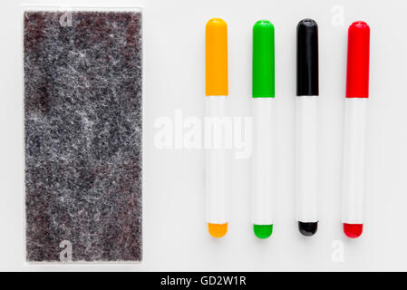 four markers and felt for office white whiteboard isolated Stock Photo