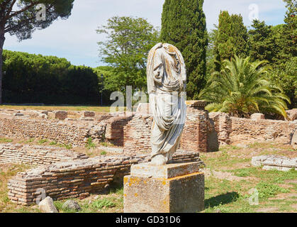 Headless statue amongst the ruins of Rome's ancient port Ostia Antica Lazio Italy Europe