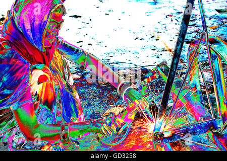 Women welding joints during the construction of solar cookers at the Barefoot College in Tilonia, Rajasthan, India. Stock Photo