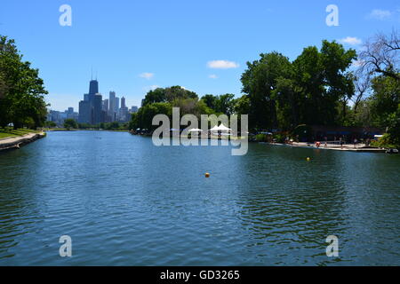 The John Hancock Building and the Chicago skyline loom over the Lincoln Park Lagoon on the cities north side Stock Photo