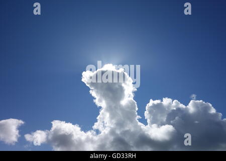 Sun breaking through thick cloud after rains finally pass. Stock Photo