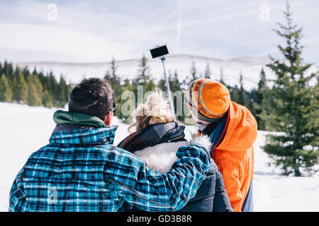 man taking selfie in ski helmet goggles and mask snowboarding Stock Photo -  Alamy