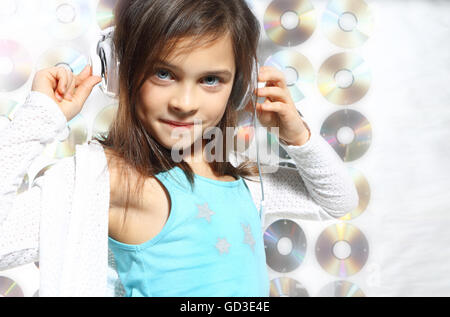 Child, teen, girl, singing into a microphone, a small singer. Stock Photo