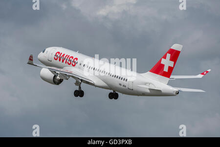 Farnborough, Hampshire UK. 11th July 2016. Bombardier’s first 125 seat CS100 aircraft supplied to airline operator Swiss takes off from The Farnborough International Trade Show before entering service on 15 July between Zurich and Paris Charles de Gaulle. The superquiet jet makes a flypast before departing Farnborough. Credit:  aviationimages/Alamy Live News. Stock Photo