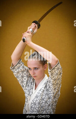 Berlin, Germany. 06th July, 2016. Vivien Weiselowski demonstrates the use of the japanese long sword (Katana). The student teacher from Berlin practices the art of Japanese swordsmanship Kenjutsu for three years now. | usage worldwide © dpa/Alamy Live News Stock Photo