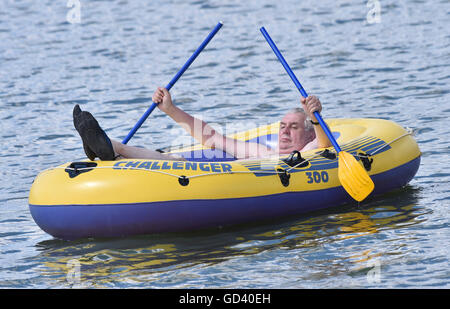 Nove Veseli, Vysocina Region. 4th July, 2016. Czech President Milos Zeman enjoys a inflatable boat ride around pond in Nove Veseli, Vysocina Region, Czech Republic, July 4, 2016. CTK Photo/Lubos Pavlicek) Stock Photo
