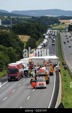 Guxhagen, Germany. 12th July, 2016. Rescue forces on site after a heavy accident on motorway A7 between Fulda and Kassel near Guxhagen, Germany, 12 July 2016. At least three people were killed during the accident involving six trucks, a caravan and a car. PHOTO: UWE ZUCCHI/dpa/Alamy Live News Stock Photo