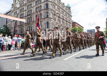 Belfast, UK. 12th July 2016. Orangemen  dressed in World War one army fatigues celebrate the Twelfth. It originated during the late 18th century in Ulster. It celebrates the Glorious Revolution (1688) and victory of Protestant king William of Orange over Catholic king James II at the Battle of the Boyne (1690) Credit:  Bonzo/Alamy Live News Stock Photo