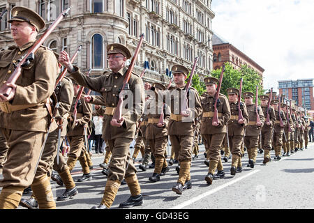 Belfast, UK. 12th July 2016. Orangemen  dressed in World War one army fatigues celebrate the Twelfth. It originated during the late 18th century in Ulster. It celebrates the Glorious Revolution (1688) and victory of Protestant king William of Orange over Catholic king James II at the Battle of the Boyne (1690) Credit:  Bonzo/Alamy Live News Stock Photo