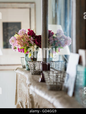 Assorted roses on mantlepiece Stock Photo