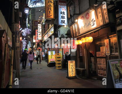 People visit Omoide Yokocho bar street in Shinjuku Tokyo Japan providing a delightful journey back in the post World War II days Stock Photo