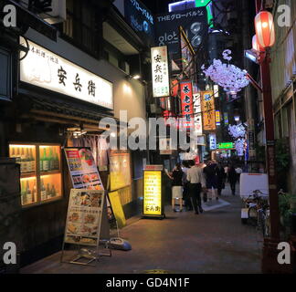 People visit Omoide Yokocho bar street in Shinjuku Tokyo Japan providing a delightful journey back in the post World War II days Stock Photo