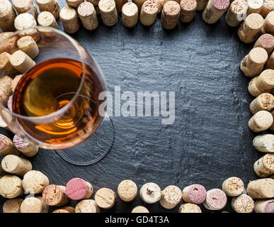 Wine corks arranged as frame on the graphite board. Stock Photo