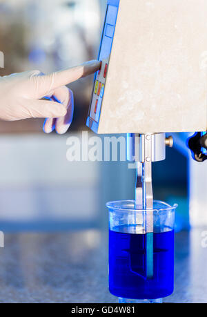 Scientist is Doing His Chemical Liquid Lab Research Stock Photo
