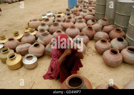 A woman waiting for the tanker Stock Photo