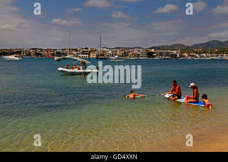 Familiy on surfboard, beach of Portocolom, Majorca, Balearic Islands, Spain Stock Photo