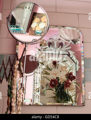 Detail of vanity mirror with painted vintage mirror in the background Stock Photo
