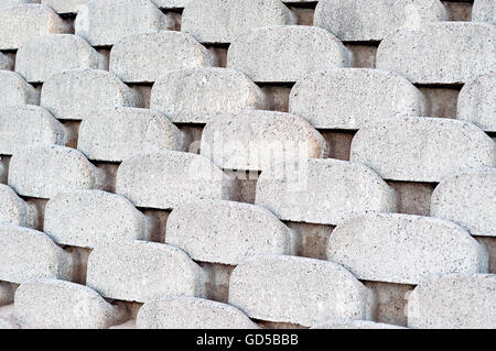 Close up patterns and textures of curved interlocking concrete retaining wall bricks Stock Photo