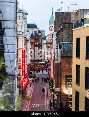 The neon signs of the Windmill theatre seen from a flat on Windmill Street. Stock Photo