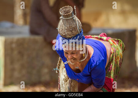 Tharu woman in nepali terai wearing traditional clothing to go fishing Stock Photo